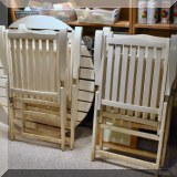 L29. Folding outdoor table and four chairs.